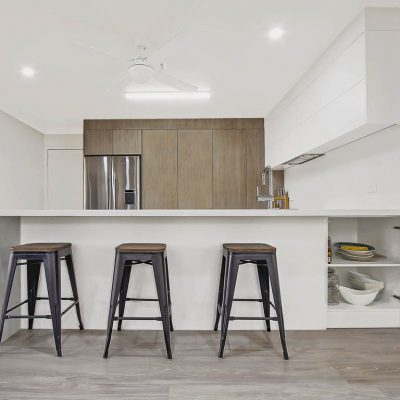 South Windsor Modern Kitchen with stone waterfall edge Timber Ravine Pantry Cupboard and hidden cabinets