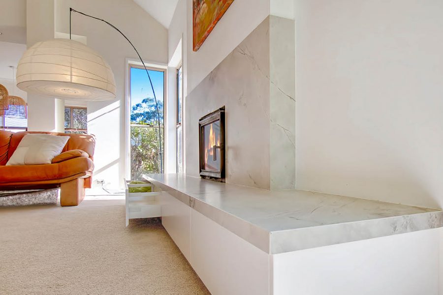 Mount Annan Fireplace with porcelain stone hearth and white cabinets