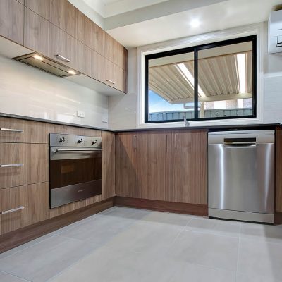 Richmond flat panel kitchen, timber ravine cabinets, black sliding window, stainless steel appliances