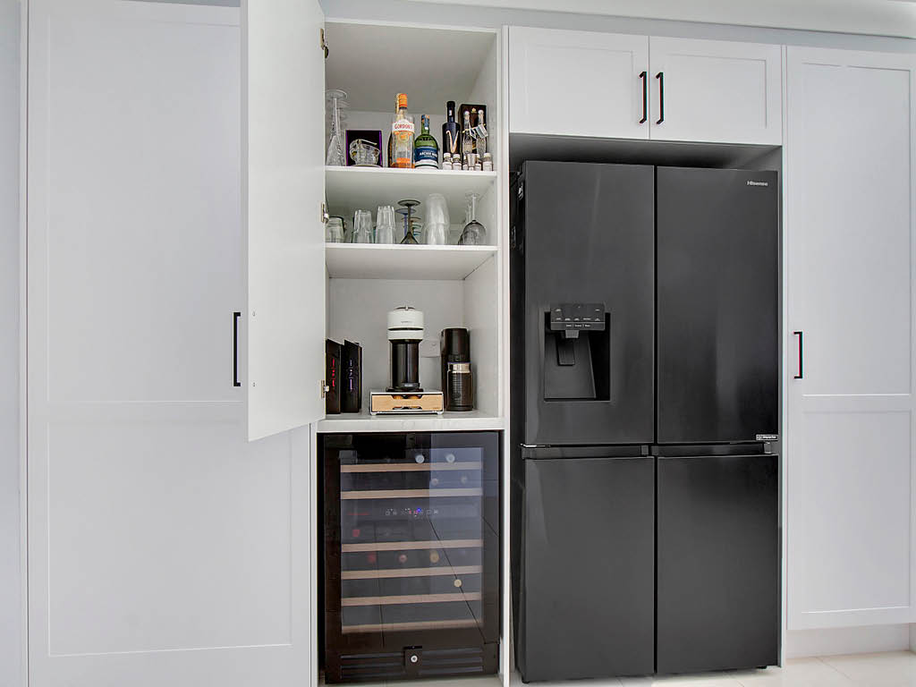 Schofields kitchen with white shaker panels and wine fridge