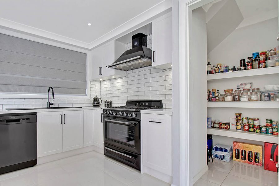 Schofields Kitchen with white shaker panels and walk in pantry