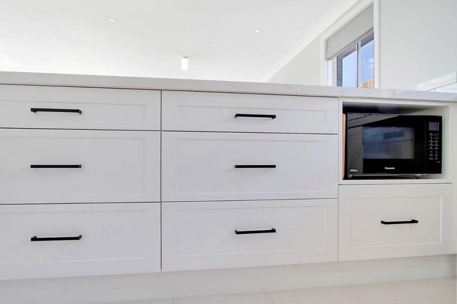 Schofields Kitchen with white shaker panels and microwave nook